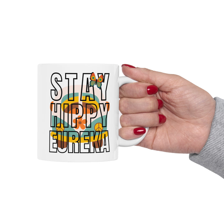 Stay Hippy Eureka Mug being held