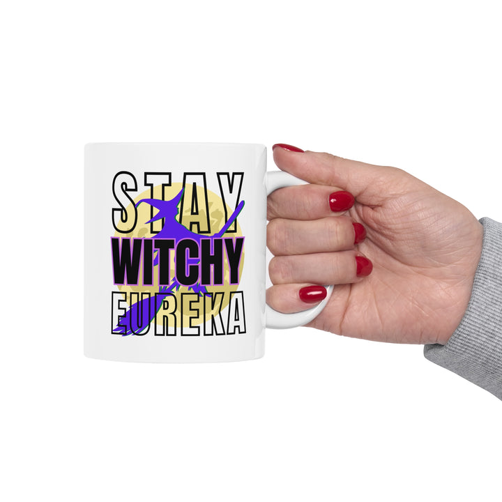 Holding the Stay Witchy Eureka Mug