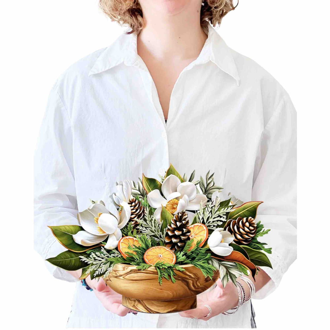 Elegant white magnolia blossoms in a winter-themed pop-up greeting card.